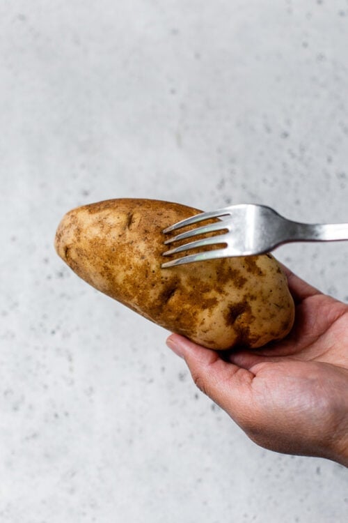 Pierce potato all over with a fork.