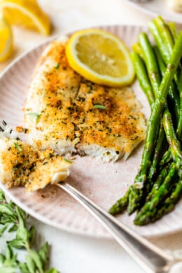 Broiled Tilapia Oreganata with lemon and asparagus