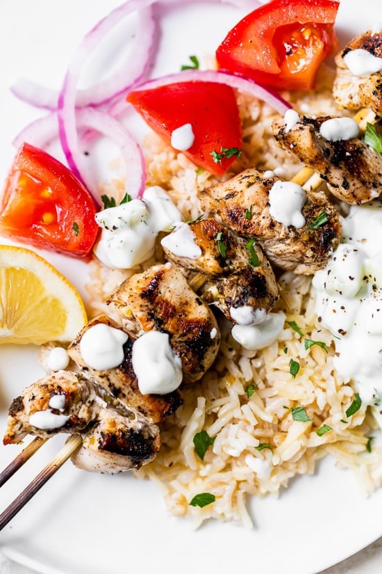 Grilled Chicken Kabobs on a plate with rice pilaf