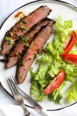 The marinade in this Grilled Asian-style Soy Marinated Flank Steak takes an uninteresting piece of steak and turns it into a mouthwatering dish!