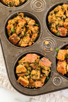 Stuffing Muffins baked in a muffin tin for easy portion control! This classic stuffing recipe is made even more delicious with Pancetta!